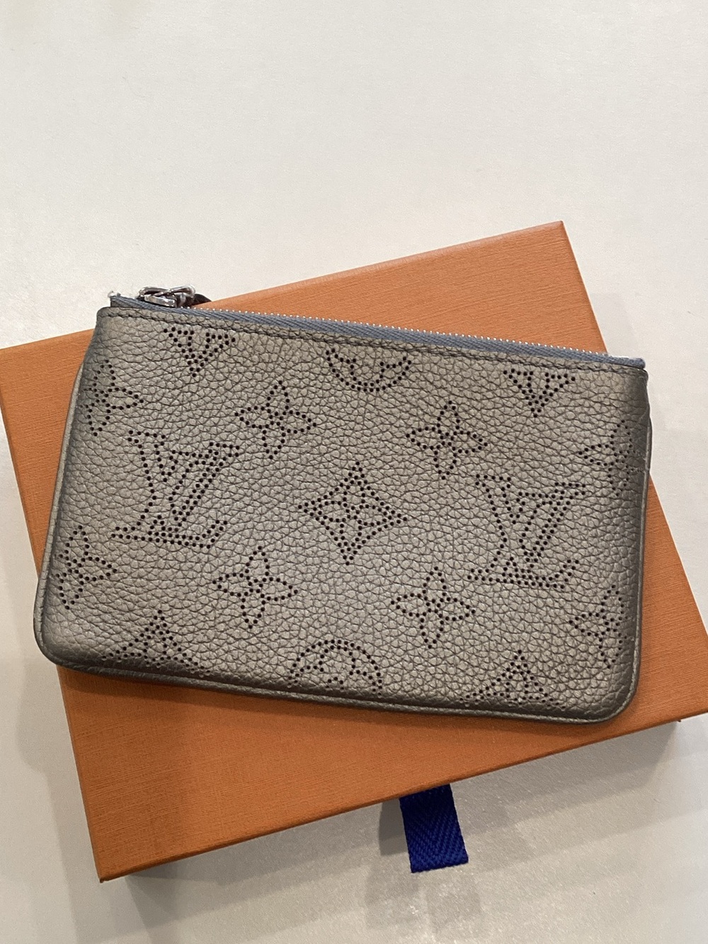 Louis Vuitton Perforated Monogram Zip Pouch in Silver-Grey